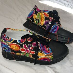 Unity in Diversity tennis shoe never worn